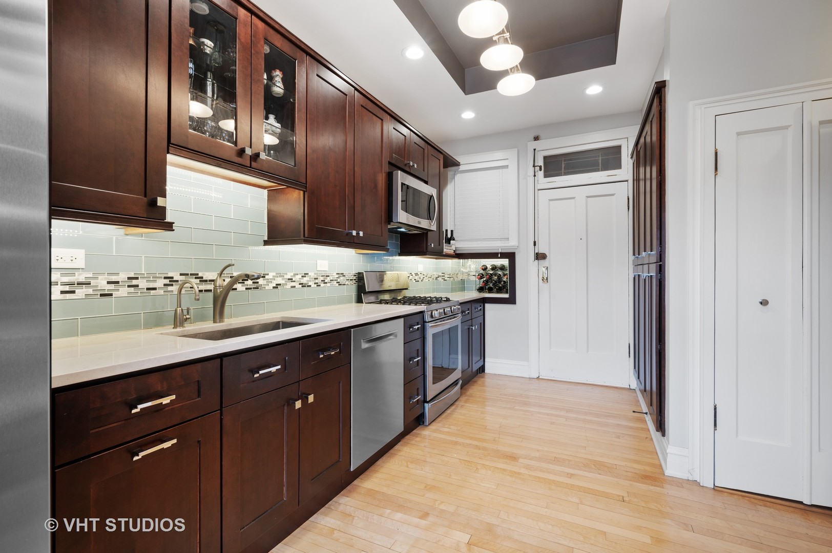 815 Ridge Avenue, Unit 3 Evanston, IL 60202 - Photo 5 of 16 a kitchen with stainless steel appliances granite countertop a sink and cabinets