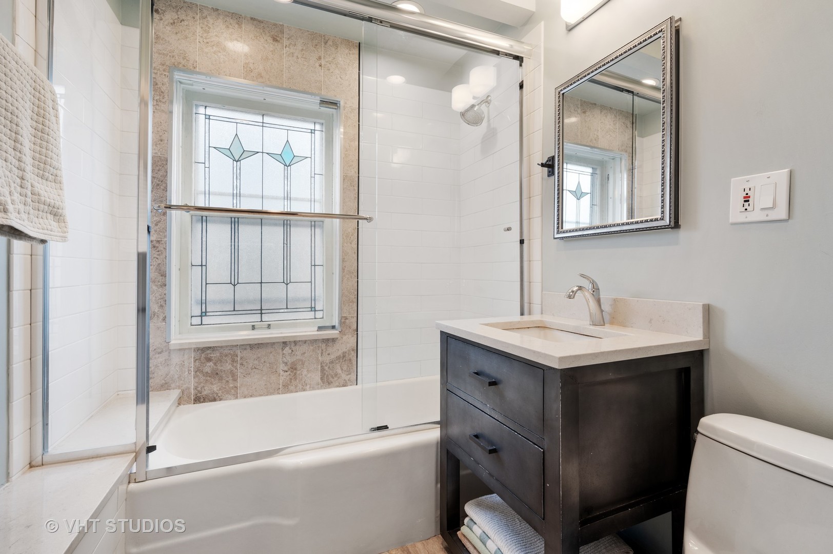 815 Ridge Avenue, Unit 3 Evanston, IL 60202 - Photo 10 of 16 a bathroom with a sink a toilet and shower