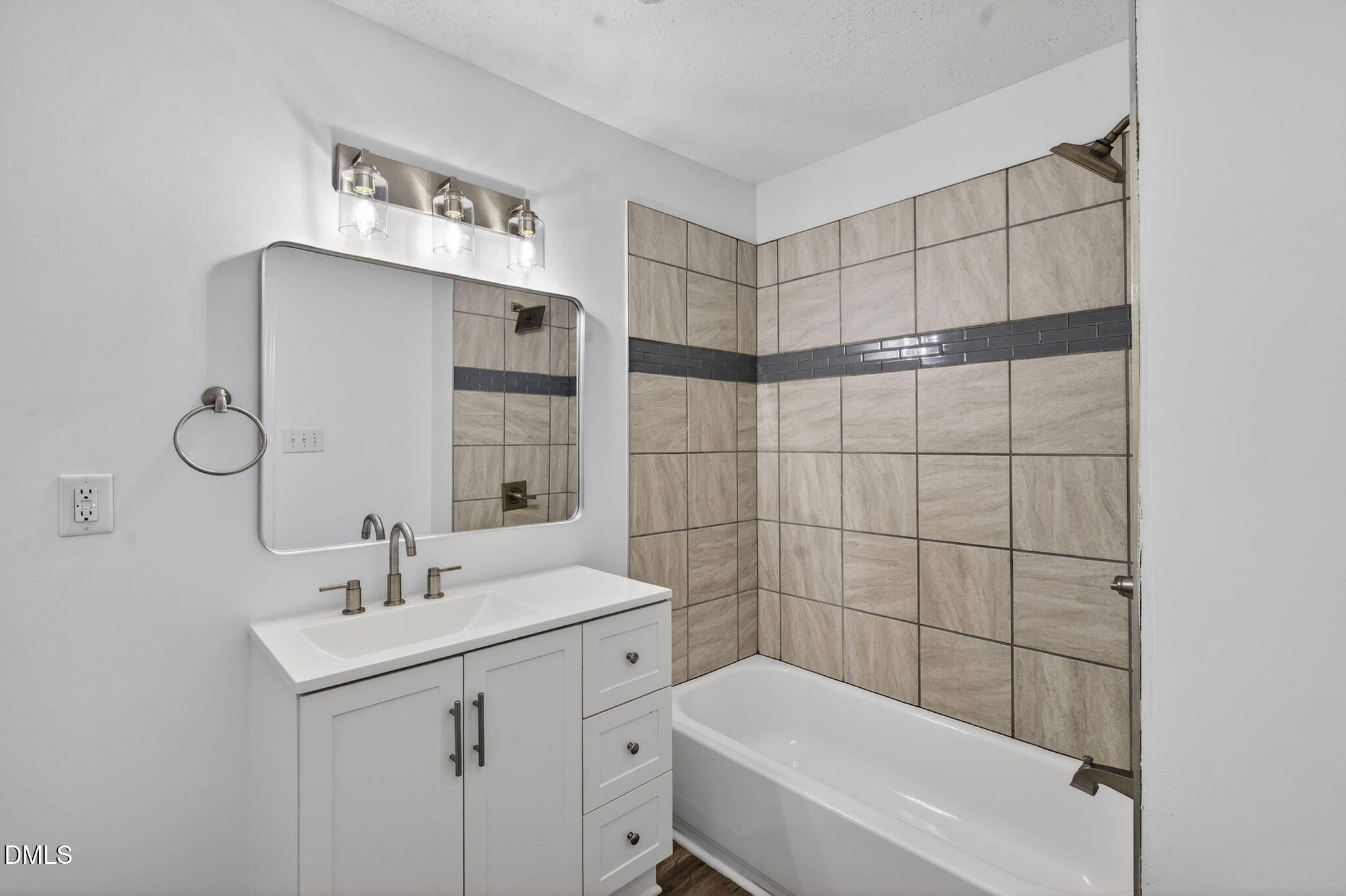 904 Seabrook Road Raleigh, NC 27610 - Photo 17 of 31 a bathroom with a sink toilet and shower