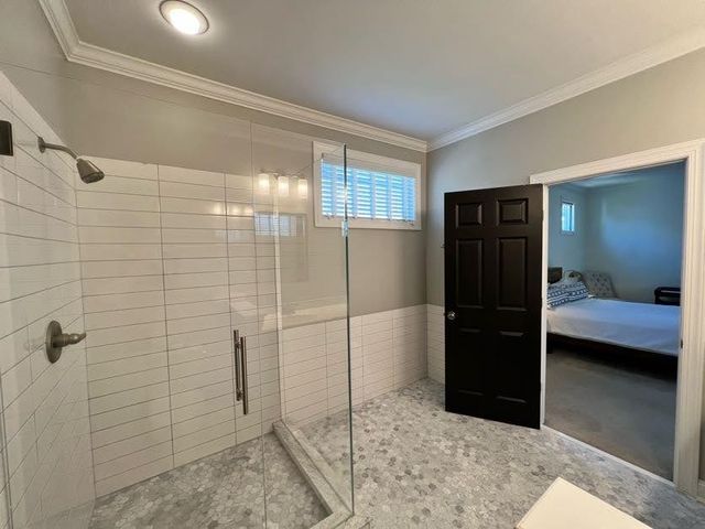 a bathroom with a shower and a sink