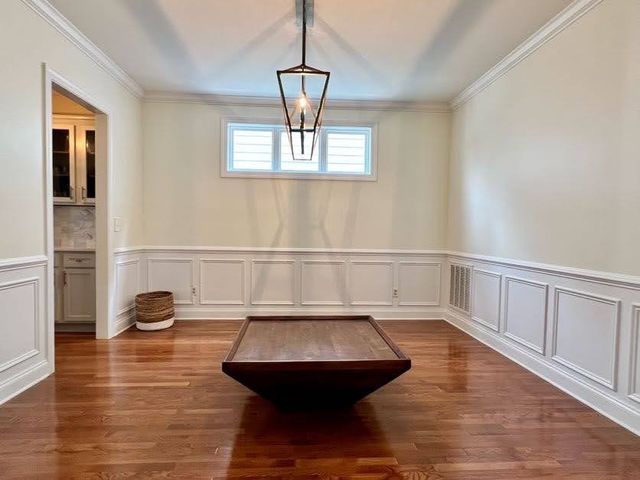 a room with table and chairs