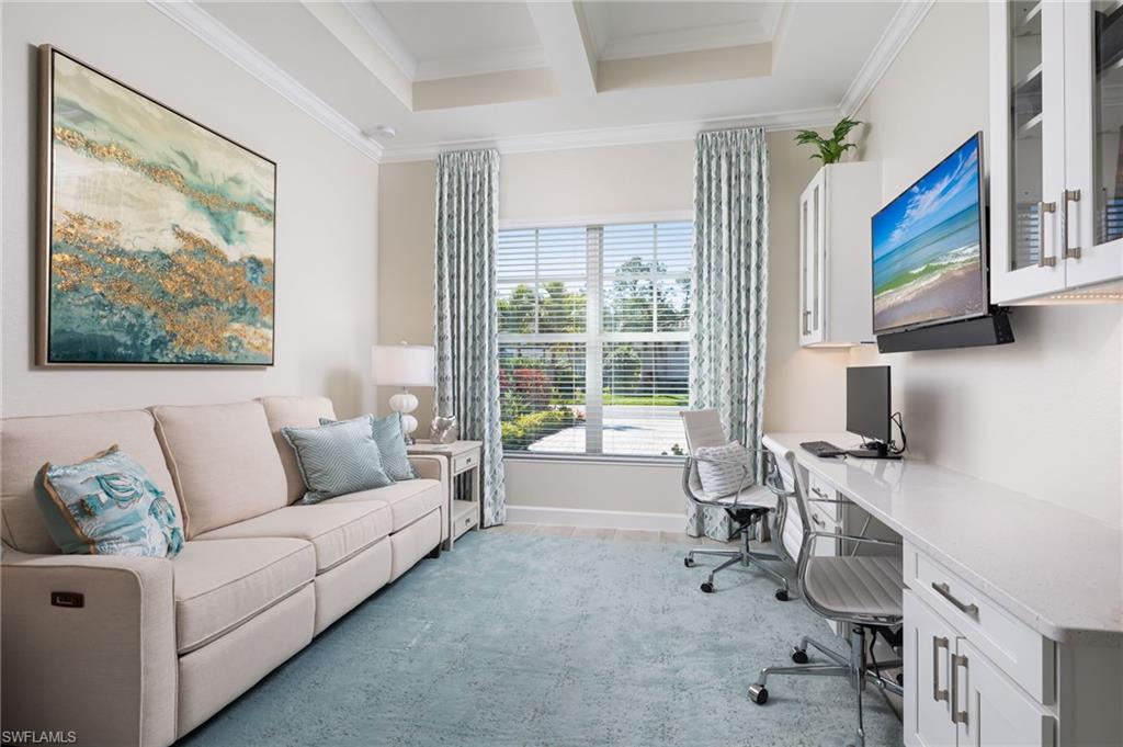14627 Nicholas Way Naples, FL 34109 - Photo 18 of 27 a living room with furniture and a flat screen tv