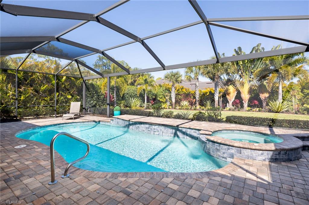 14627 Nicholas Way Naples, FL 34109 - Photo 22 of 27 a view of a swimming pool with a patio
