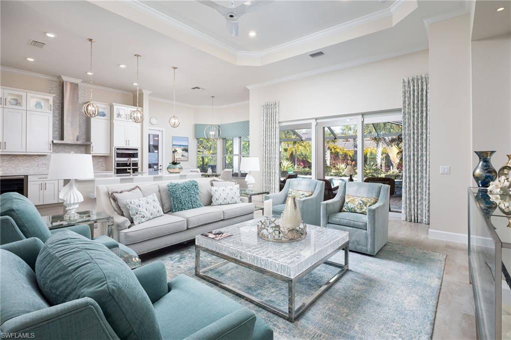 14627 Nicholas Way Naples, FL 34109 - Photo 3 of 27 a living room with furniture and a large window