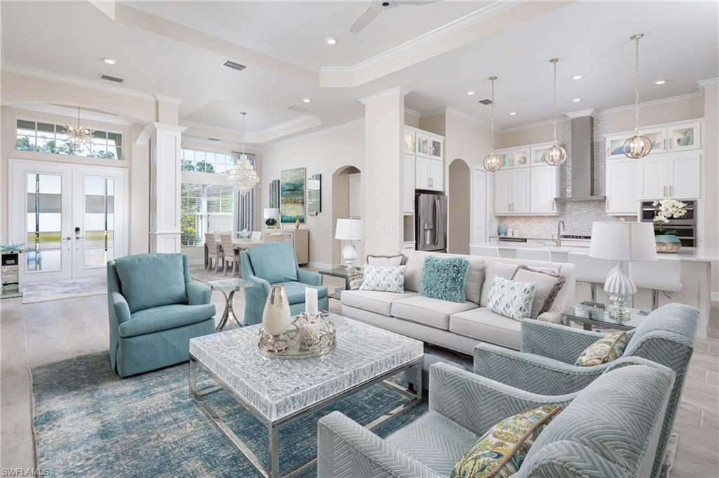 14627 Nicholas Way Naples, FL 34109 - Photo 6 of 27 a living room with furniture kitchen view and a large window