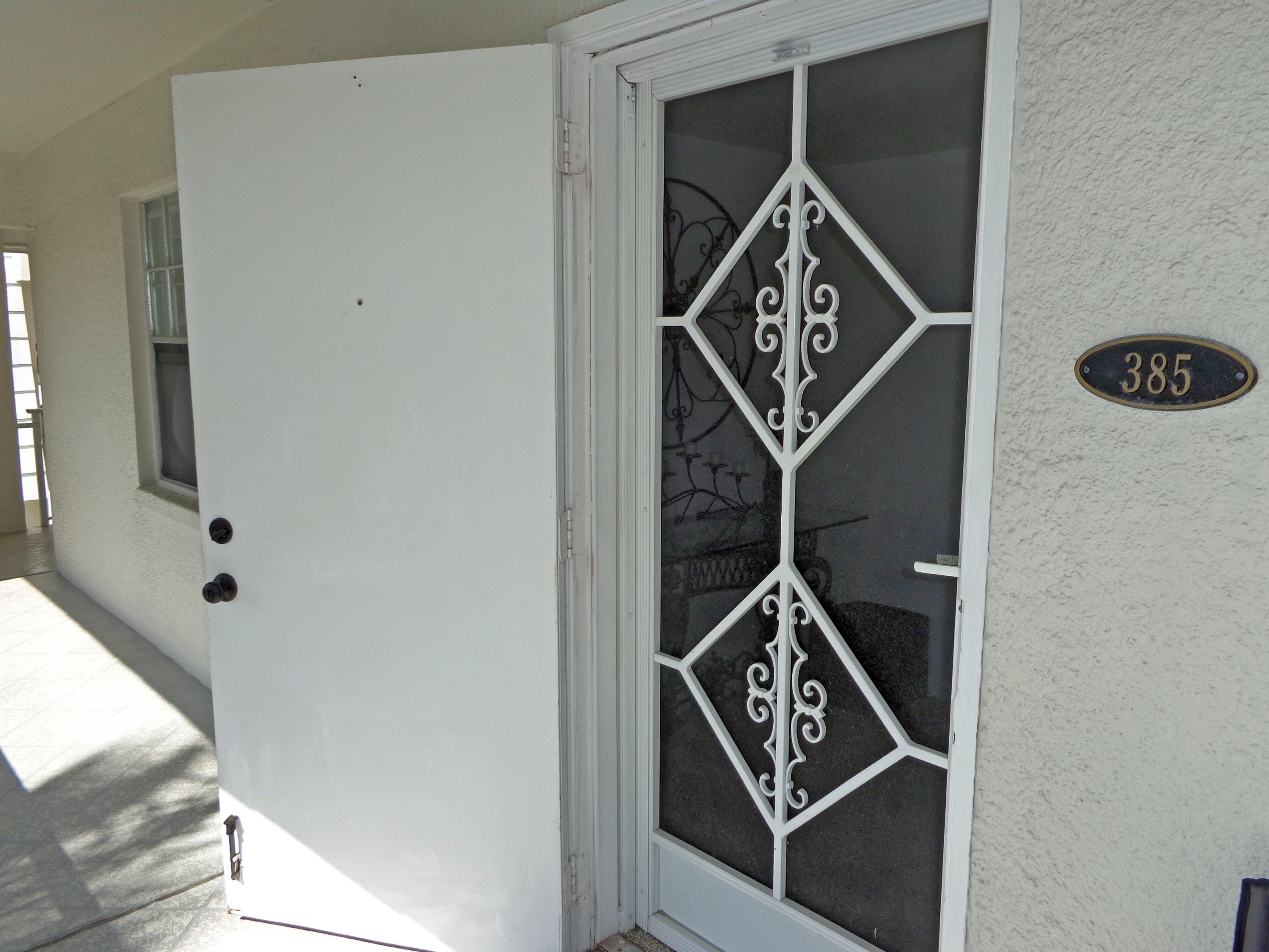 1070 Sugar Sands Boulevard, Unit 385 Riviera Beach, FL 33404 - Photo 20 of 21 Entrance Door