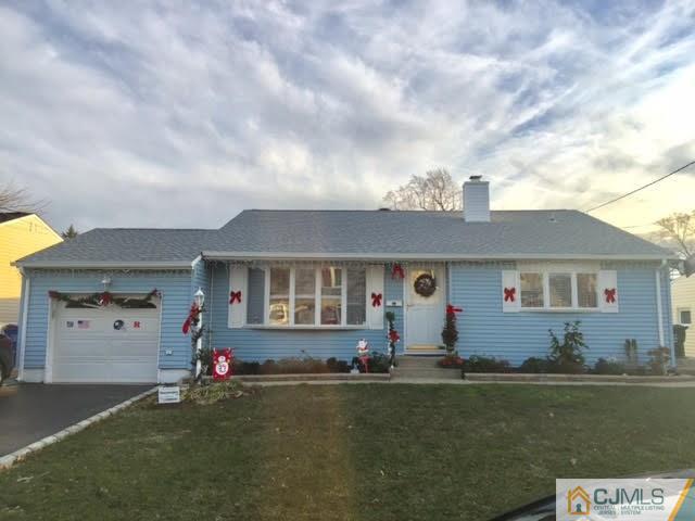 53 Albemarle Road Colonia, NJ 07067 - Photo 1 of 25 front view of a house with a garden