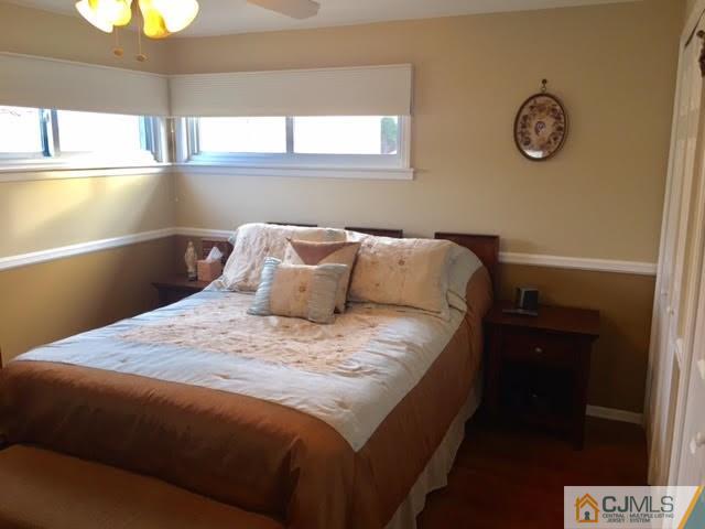 53 Albemarle Road Colonia, NJ 07067 - Photo 11 of 25 a bedroom with a bed and window