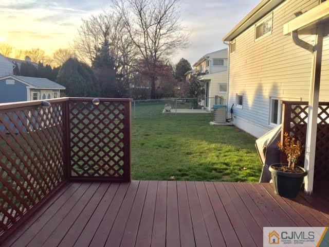 53 Albemarle Road Colonia, NJ 07067 - Photo 19 of 25 a view of a backyard with wooden floor