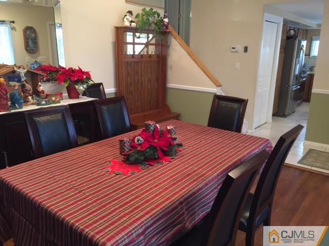 53 Albemarle Road Colonia, NJ 07067 - Photo 20 of 25 a view of a dining room with furniture and wooden floor