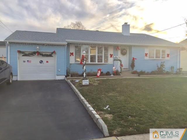 53 Albemarle Road Colonia, NJ 07067 - Photo 22 of 25 a front view of a house with a yard