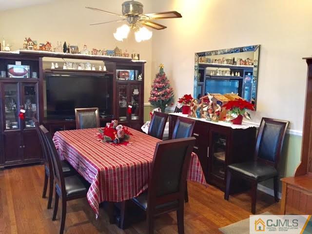 53 Albemarle Road Colonia, NJ 07067 - Photo 4 of 25 a view of a dining room with furniture and chandelier
