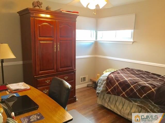 53 Albemarle Road Colonia, NJ 07067 - Photo 6 of 25 a bedroom with bed and window