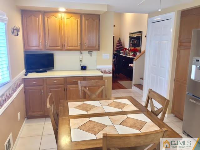 53 Albemarle Road Colonia, NJ 07067 - Photo 8 of 25 a kitchen with stainless steel appliances granite countertop a refrigerator and a stove top oven