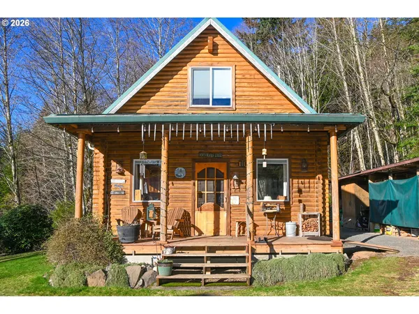 a view of house with backyard space and porch