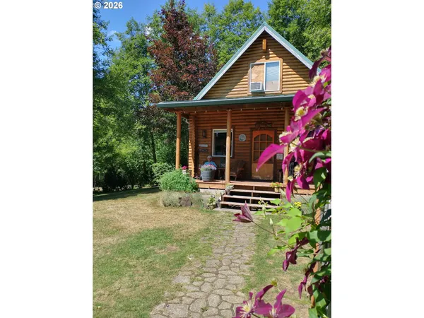 a front view of a house with yard