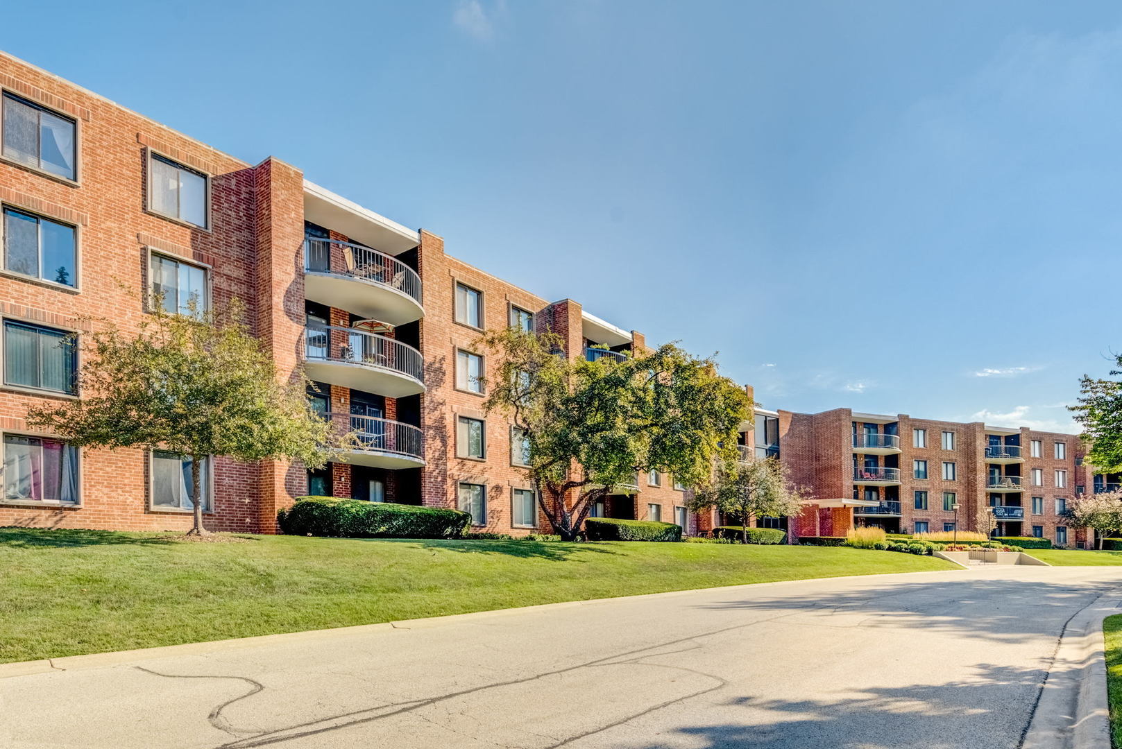 1415 East Central Road, Unit 422C Arlington Heights, IL 60005 - Photo 1 of 19 a view of a building with a yard