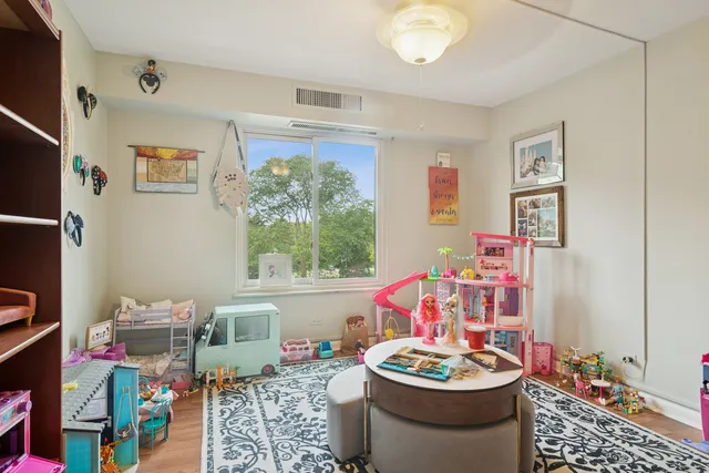 a very nice looking dining room with a large window and dining table