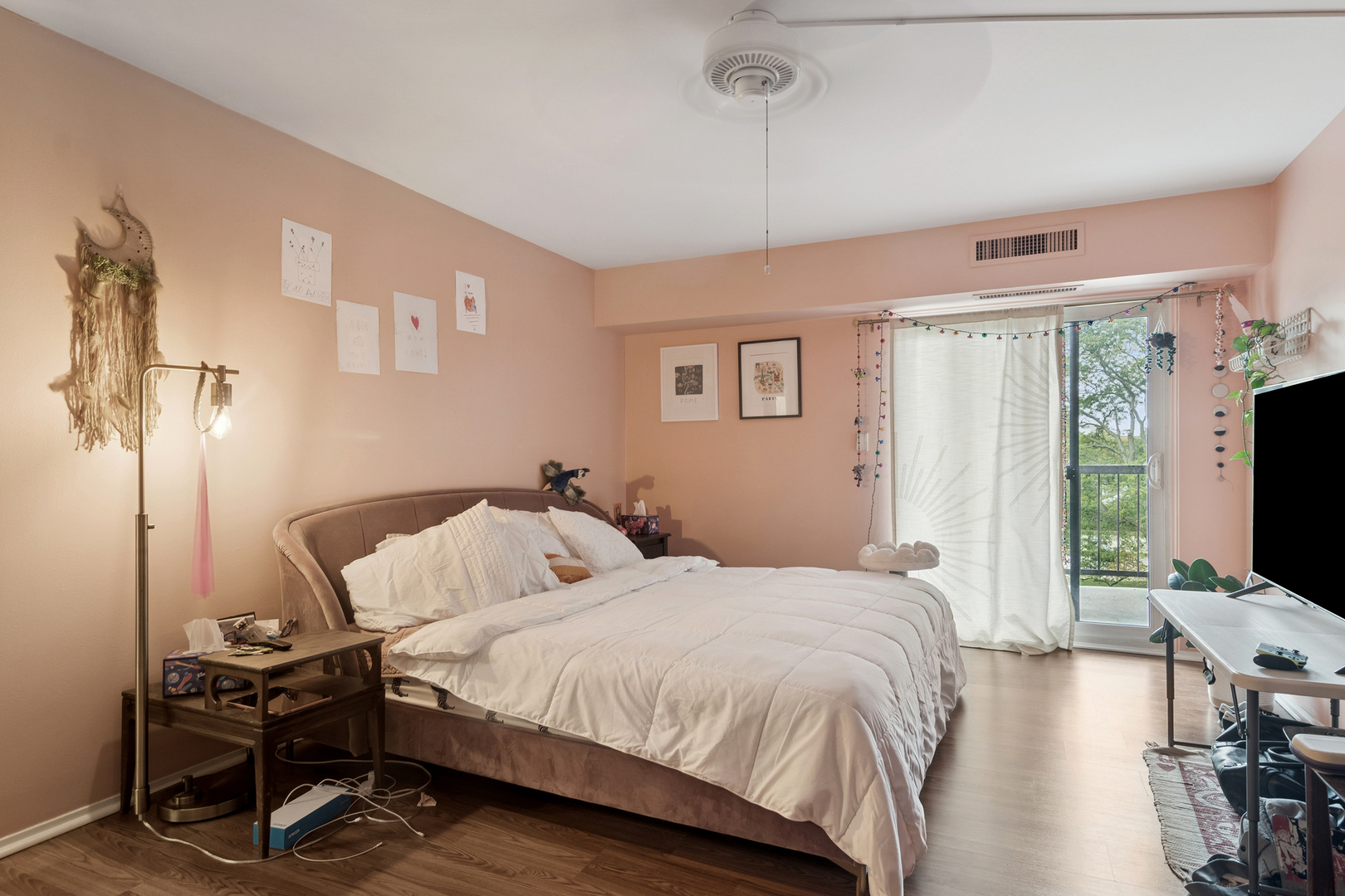 1415 East Central Road, Unit 422C Arlington Heights, IL 60005 - Photo 14 of 19 a bedroom with a bed tv and chair