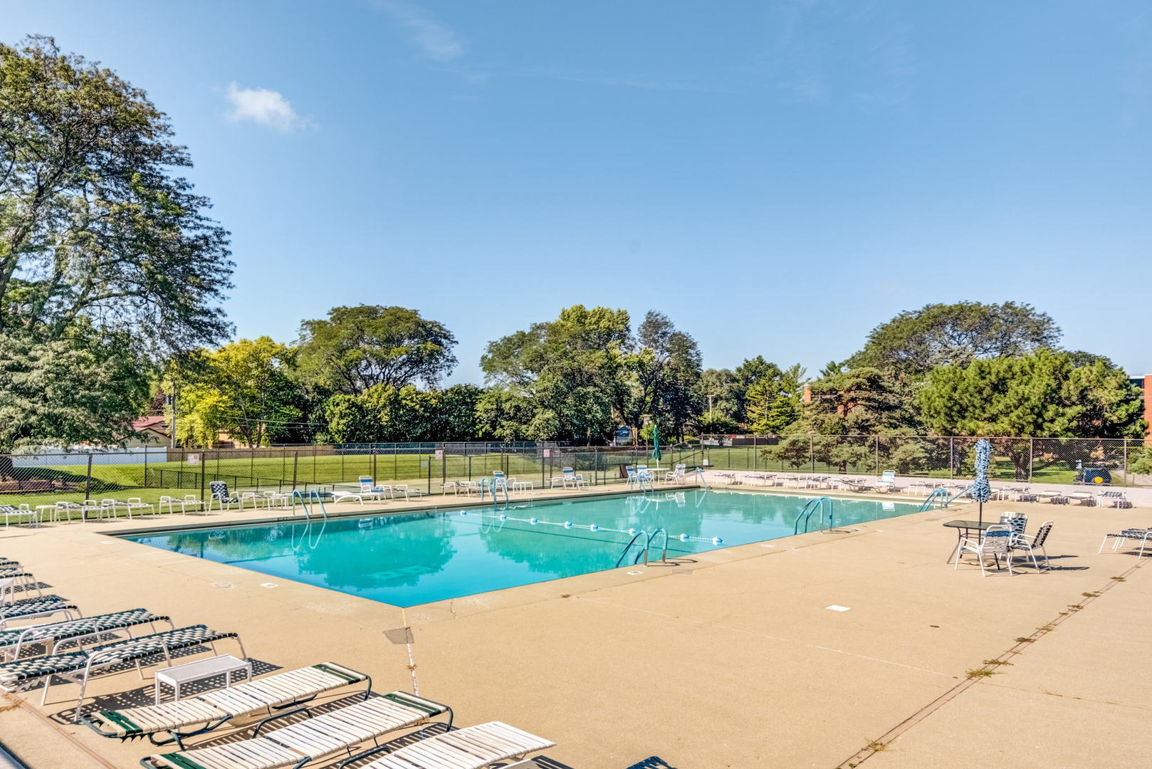 1415 East Central Road, Unit 422C Arlington Heights, IL 60005 - Photo 17 of 19 a view of a swimming pool and a yard