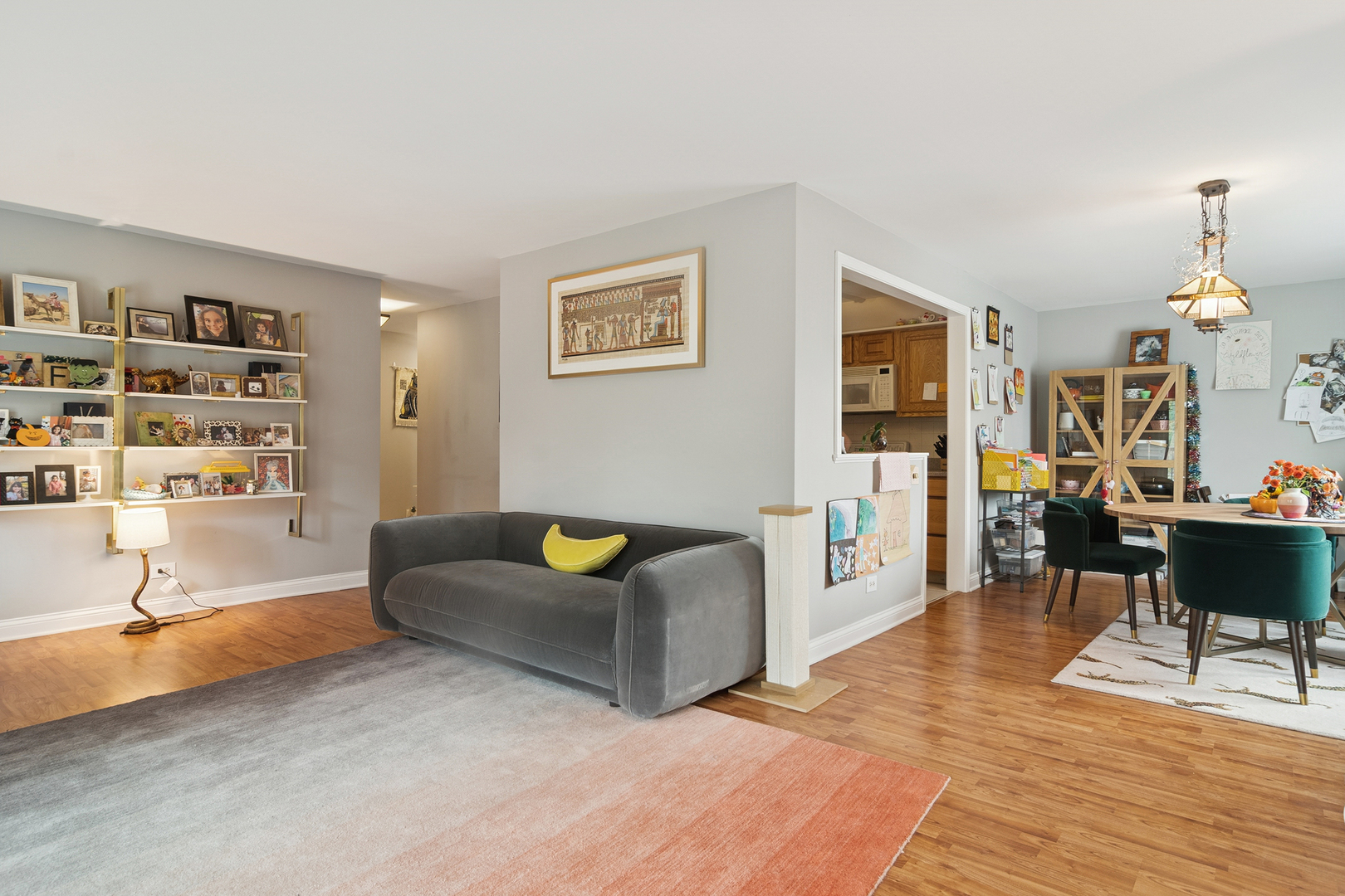 1415 East Central Road, Unit 422C Arlington Heights, IL 60005 - Photo 7 of 19 a living room with furniture a dining table and a piano