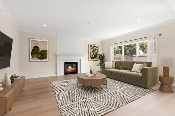 a living room with furniture a window and a fireplace