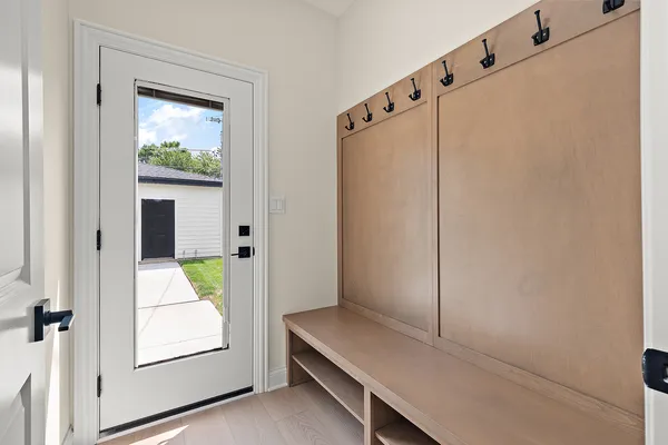 a view of an entryway with wooden floor
