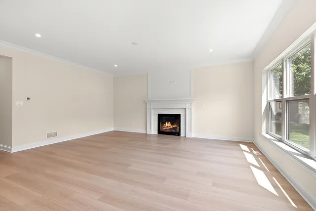 a view of a kitchen with a sink and a refrigerator