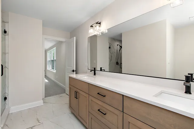 a bathroom with a sink and mirror