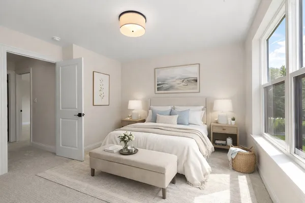 a bedroom with bed and a window