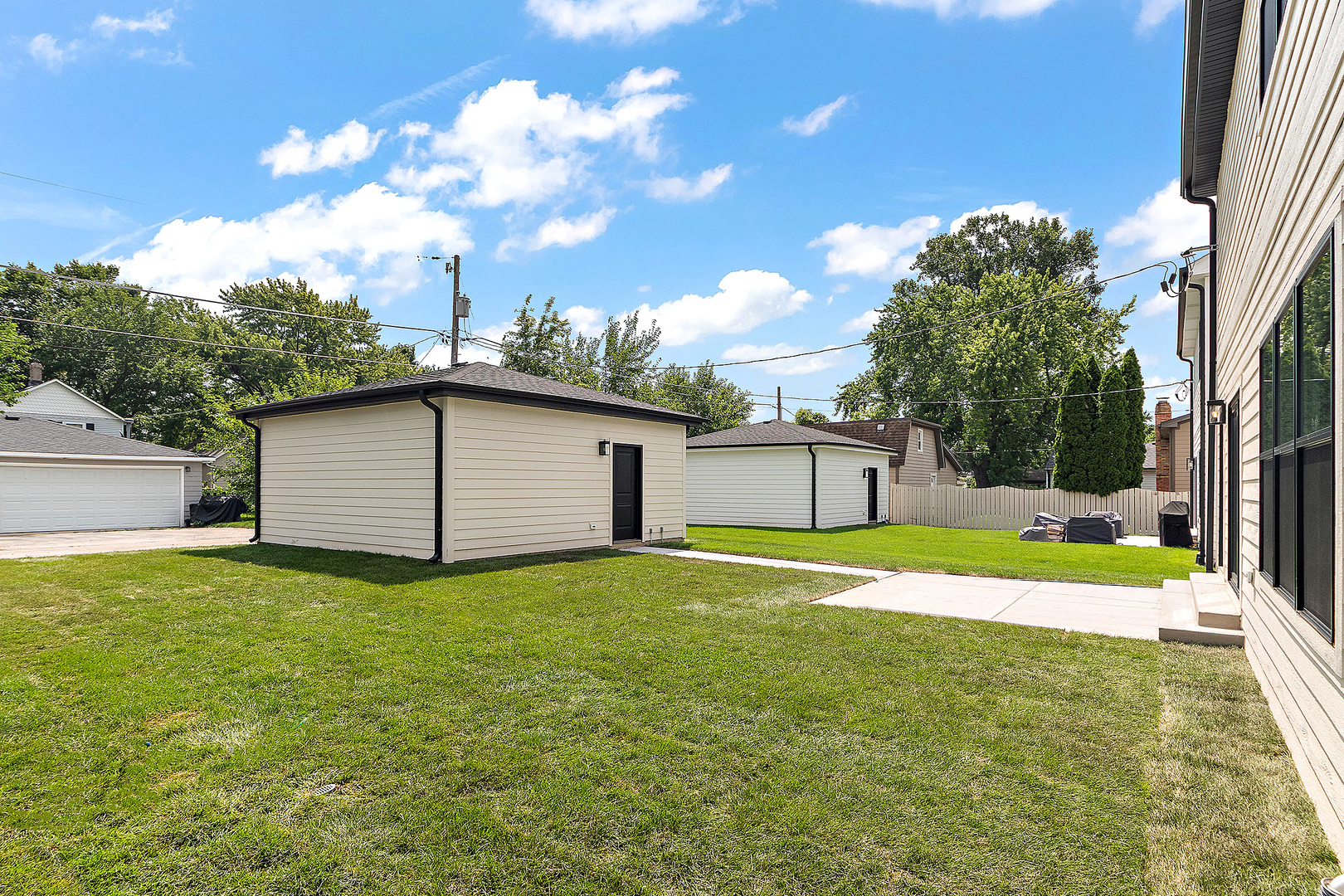 1023 Walter Street Lemont, IL 60439 - Photo 32 of 32 a house view with swimming pool in front of it