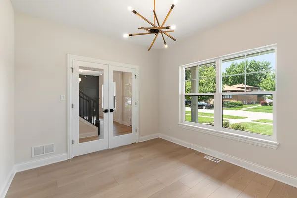 a view of a livingroom with a ceiling fan and window
