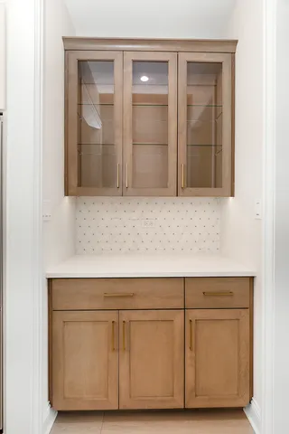 a kitchen with cabinets and appliances