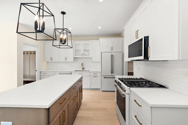 a kitchen with cabinets and appliances