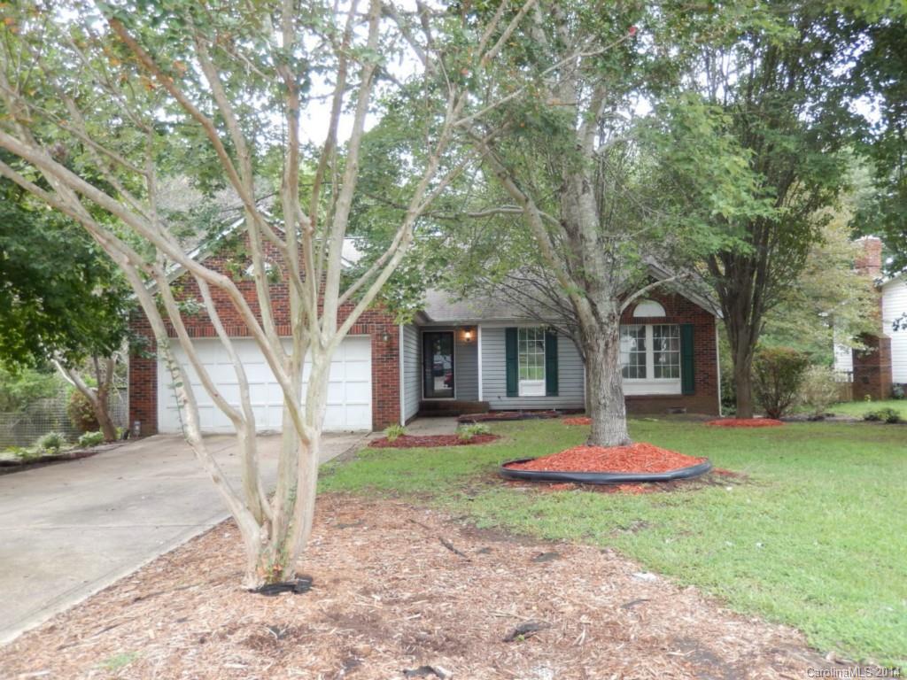 a house with trees in front of it