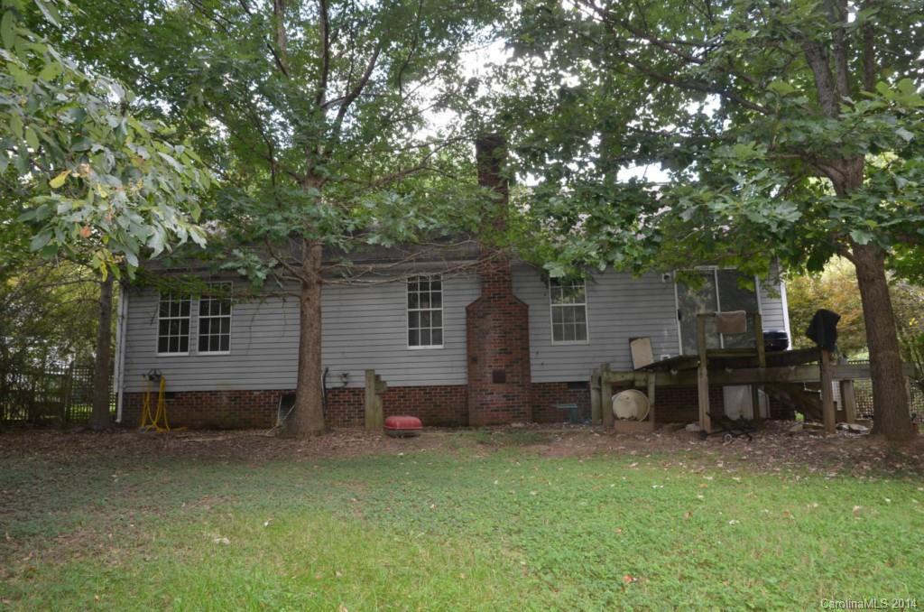 1932 Misty Vale Road Charlotte, NC 28214 - Photo 12 of 13 a backyard of a house with table and chairs