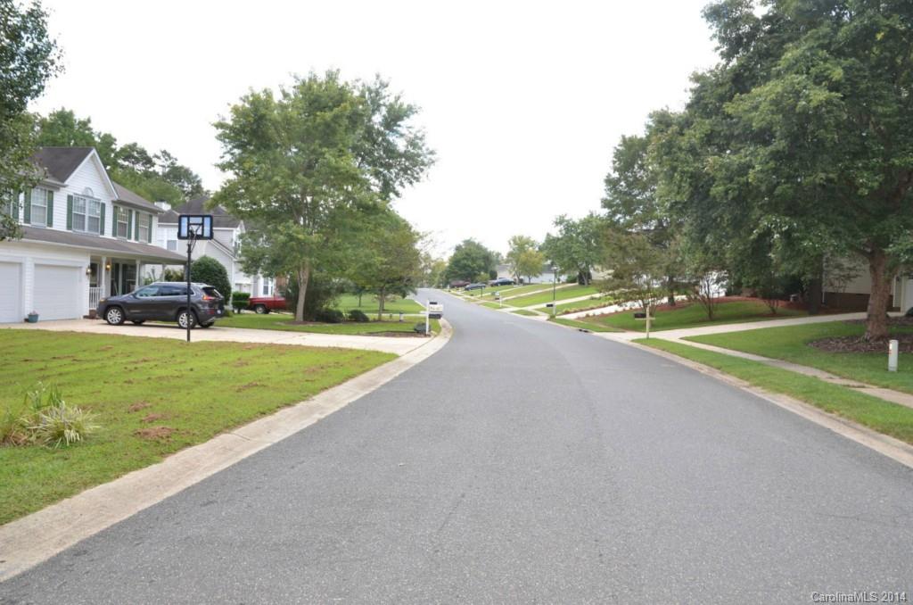1932 Misty Vale Road Charlotte, NC 28214 - Photo 13 of 13 a view of a big yard with palm trees
