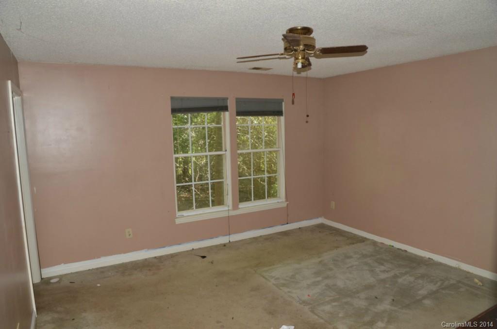 1932 Misty Vale Road Charlotte, NC 28214 - Photo 8 of 13 an empty room with a window