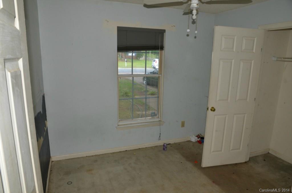 1932 Misty Vale Road Charlotte, NC 28214 - Photo 10 of 13 an empty room with windows
