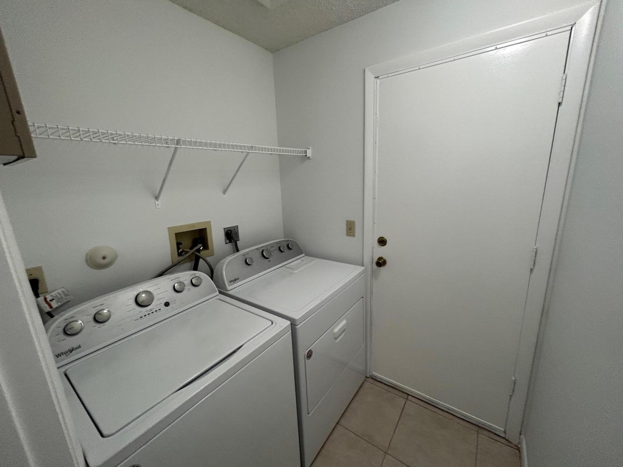 10136 Boynton Pl Circle Boynton Beach, FL 33437 - Photo 12 of 12 a utility room with dryer and washer