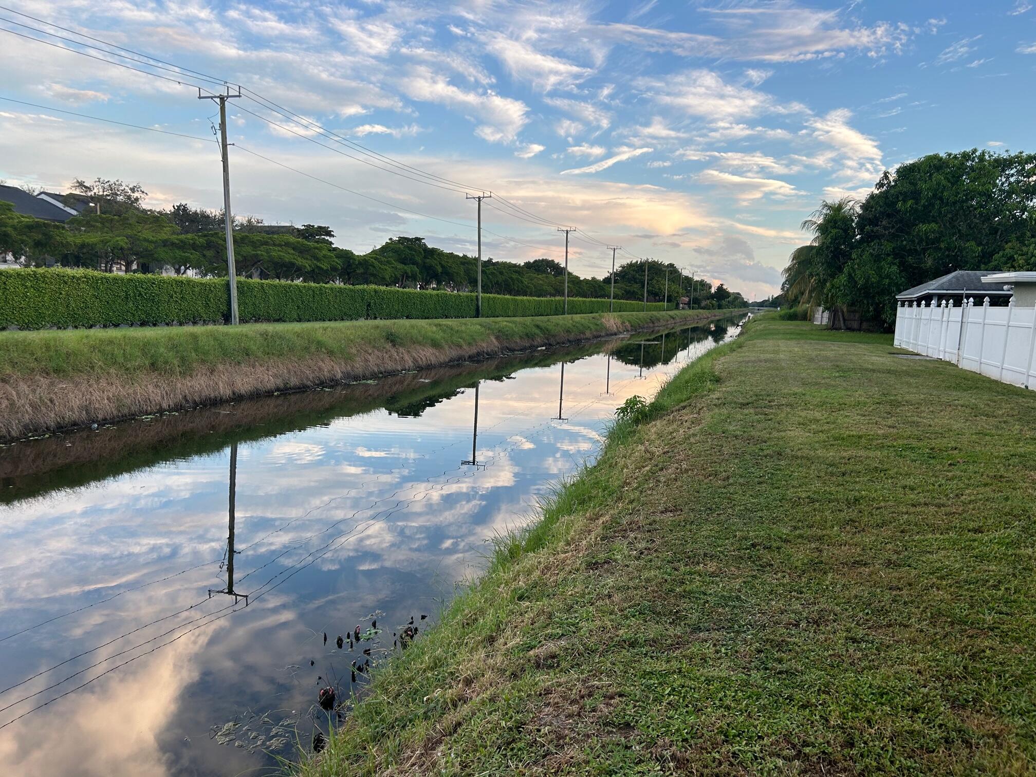 10136 Boynton Pl Circle Boynton Beach, FL 33437 - Photo 3 of 12 a view of a street with a yard