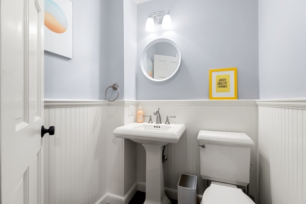 17 Swan Road Winchester, MA 01890 - Photo 13 of 41 a bathroom with a toilet sink and mirror