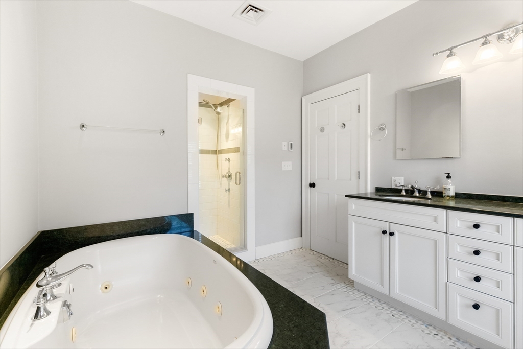 17 Swan Road Winchester, MA 01890 - Photo 27 of 41 a bathroom with a bathtub and a sink