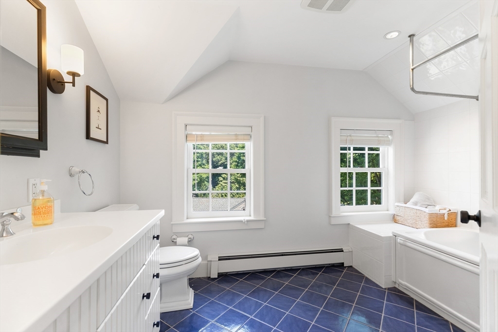 17 Swan Road Winchester, MA 01890 - Photo 31 of 41 a bathroom with a sink toilet vanity and tub