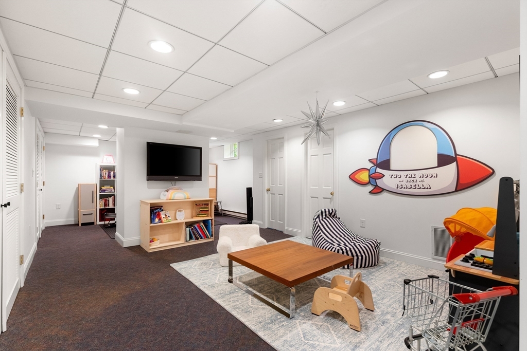 17 Swan Road Winchester, MA 01890 - Photo 33 of 41 a living room with furniture and a flat screen tv