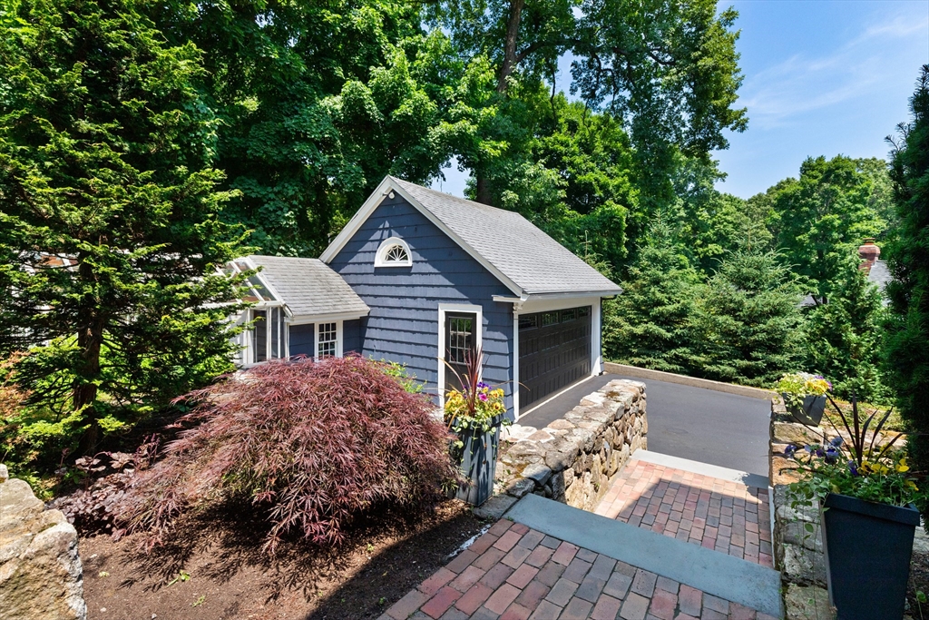 17 Swan Road Winchester, MA 01890 - Photo 37 of 41 a view of a house with a yard plants and large tree