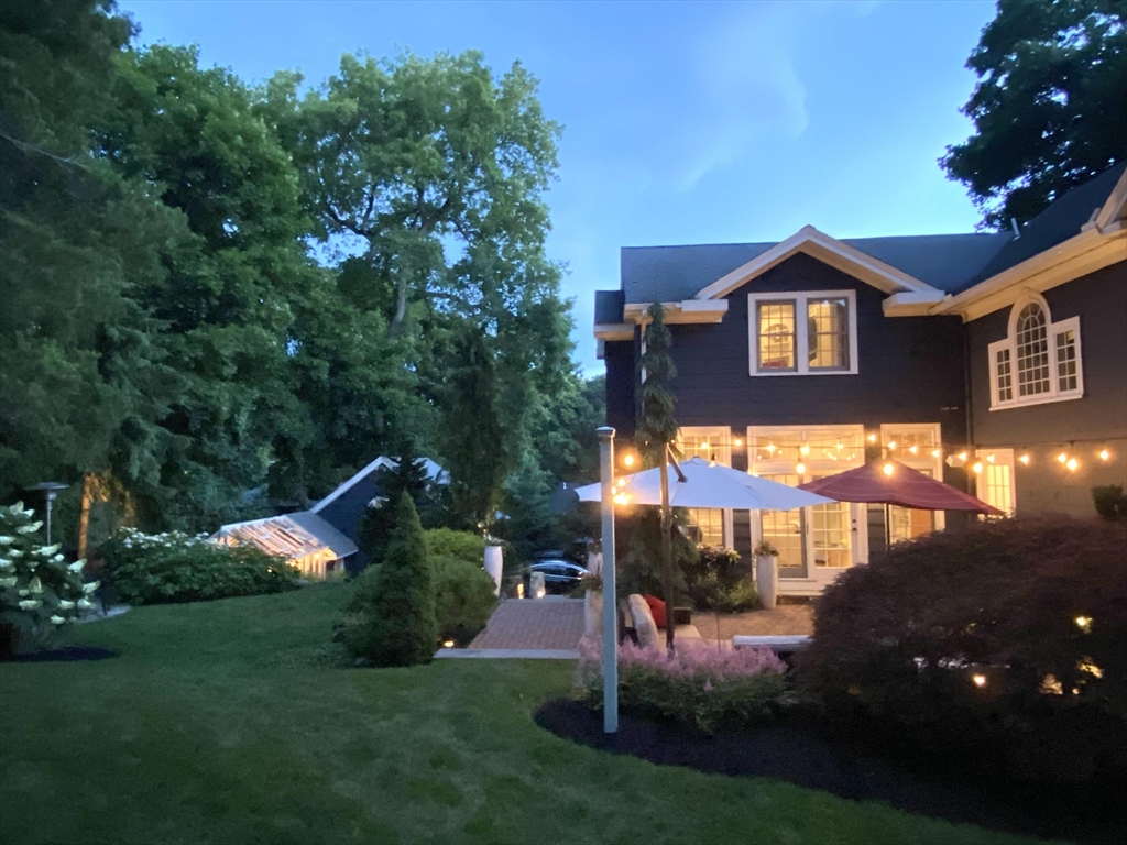 17 Swan Road Winchester, MA 01890 - Photo 40 of 41 a front view of a house with a yard and garage