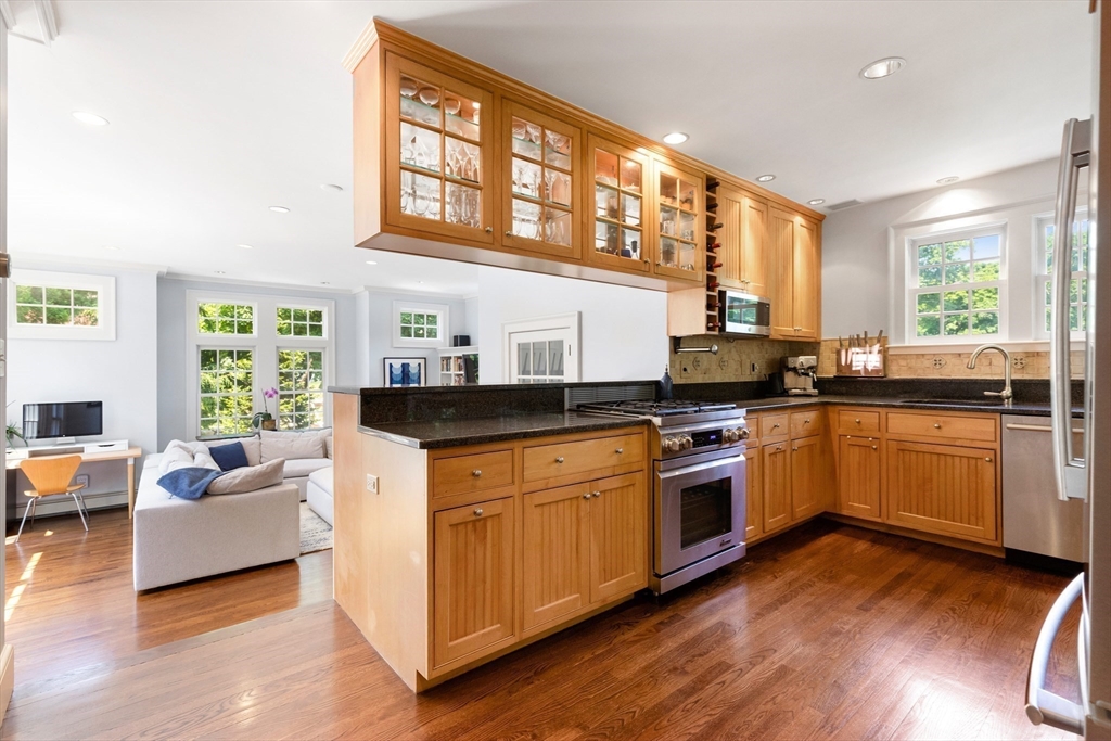 17 Swan Road Winchester, MA 01890 - Photo 5 of 41 a kitchen with stainless steel appliances granite countertop a stove a sink and a refrigerator