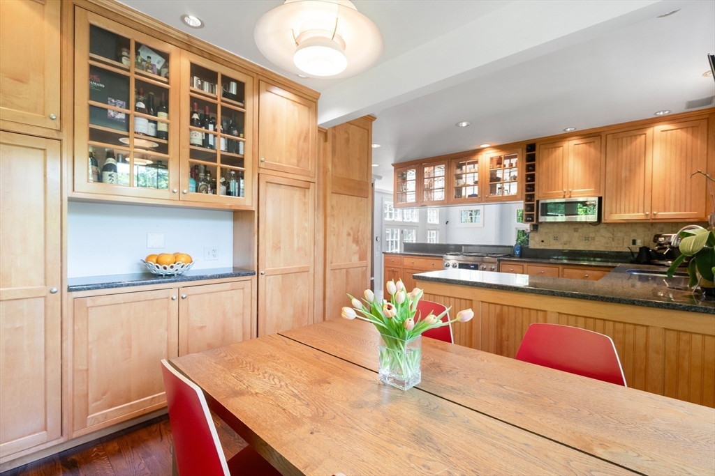17 Swan Road Winchester, MA 01890 - Photo 8 of 41 a kitchen with stainless steel appliances granite countertop sink stove and wooden cabinets