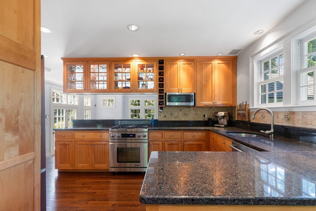 17 Swan Road Winchester, MA 01890 - Photo 9 of 41 a kitchen with stainless steel appliances granite countertop a stove a sink and a microwave